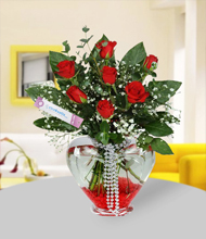 7 Red Roses in Transparent Vase
